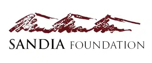 Sandia Foundation logo featuring stylized red mountain range above black text