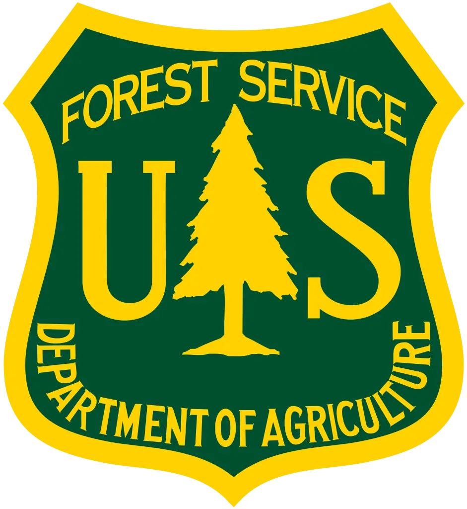 United States Forest Service logo with yellow text and pine tree on green shield