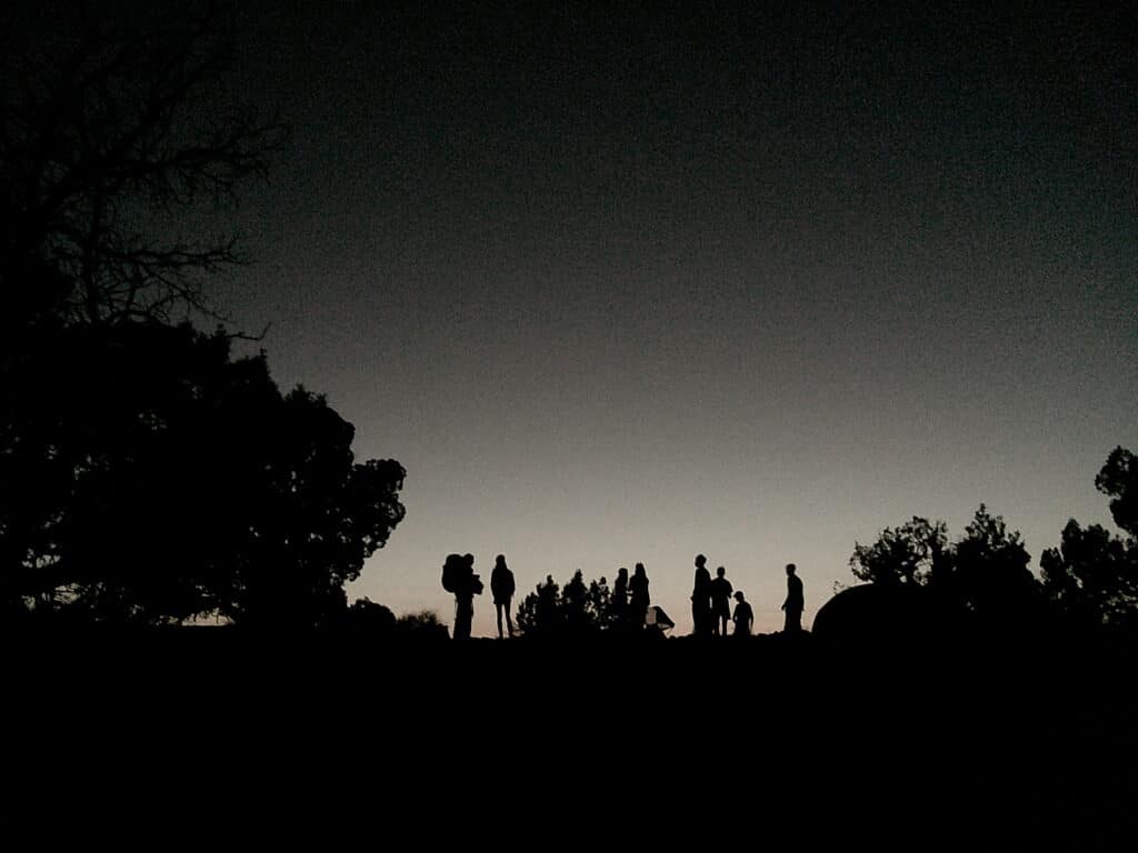 a group of of trekkers stargaze in the New Mexico wilderness on a Gulch trek.